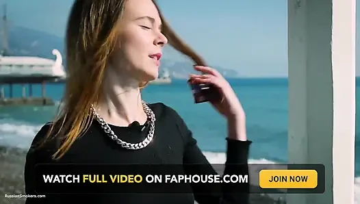 Young Russian Girl Smoking Cigarette by Seaside