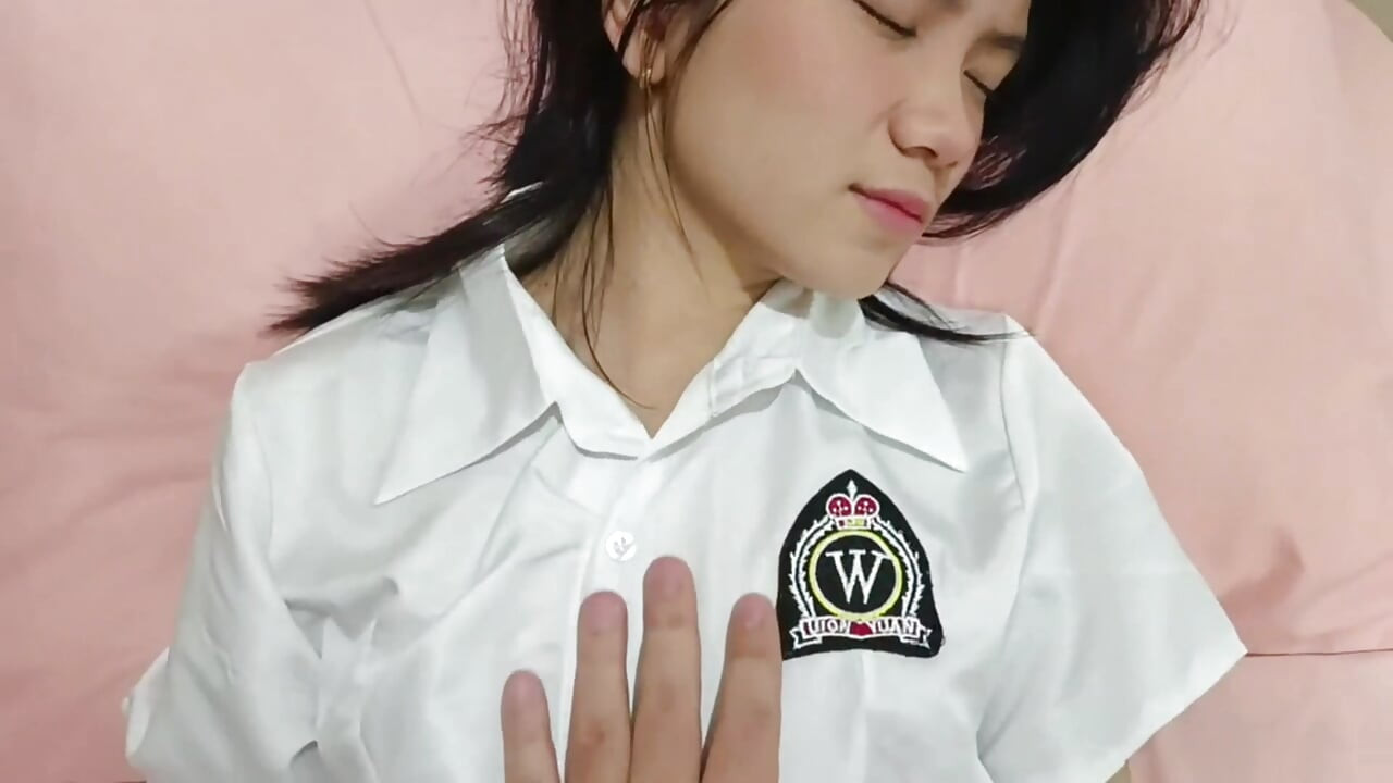 An 18-year-old asian student in school uniform gets fucked by a big white cock