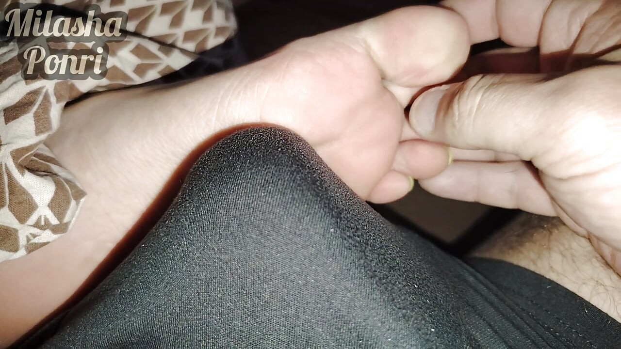 Stepsister's feet get a light massage while watching a movie
