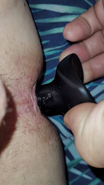Playing with Black butt plug