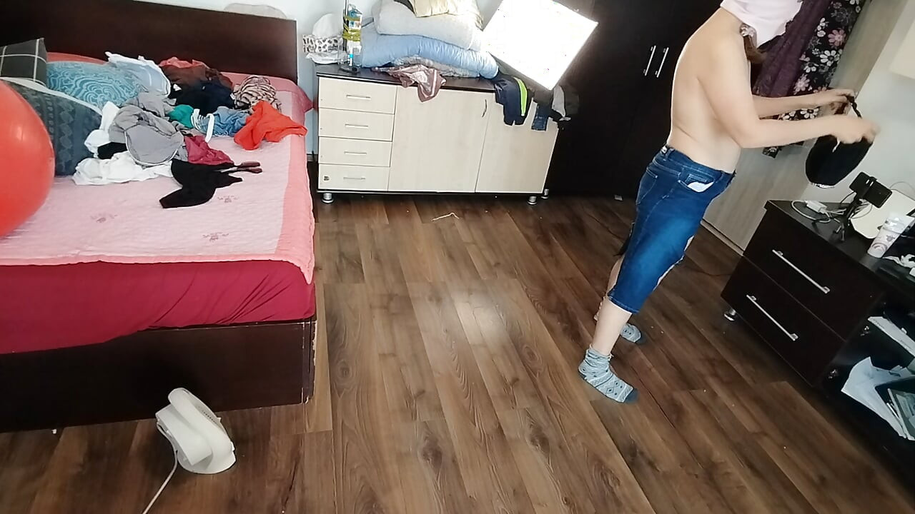 Amateur wife enjoys trying on clothes and cutting them.