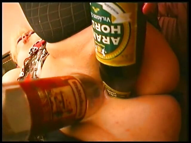 Clothed chubby mature slut drilling her holes with bottles and banana