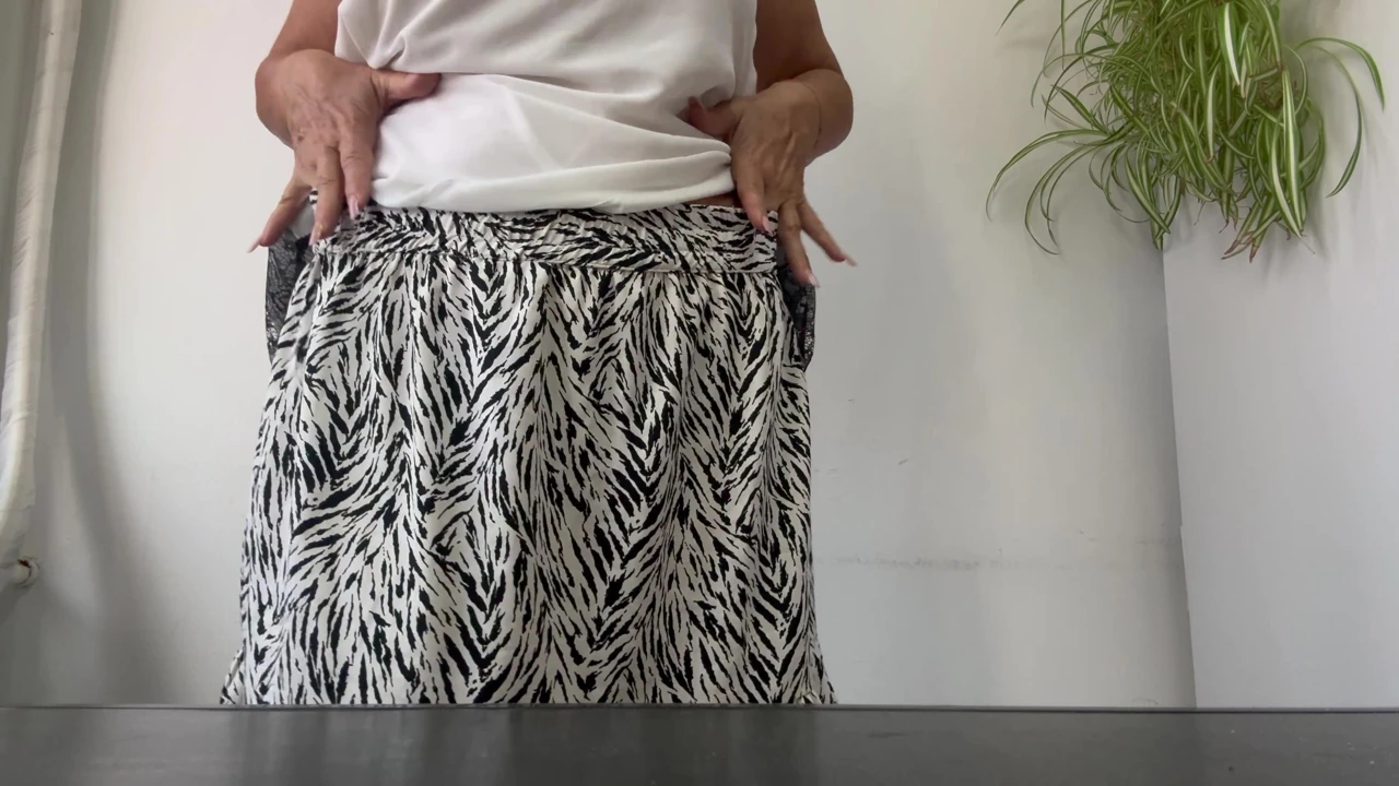 Horny stepmom Michelle puts her sexy feet in high heels on the desk.