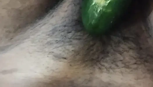 Busty bitch playing with herself and fucking herself with a cucumber
