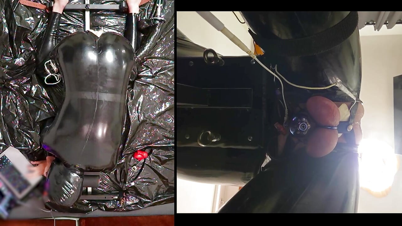 Session in the pillory with Latex Catsuit, PA Chastity, Giant Didildo and Estim