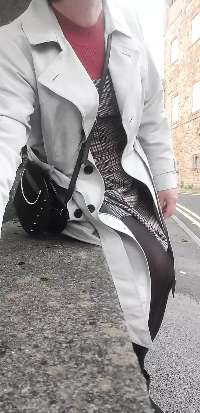 Crossdressing slut exposes her caged cock on public street