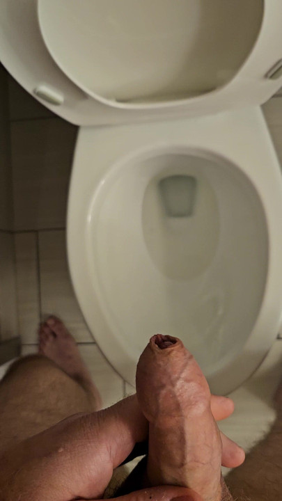Hard small uncut dick peeing