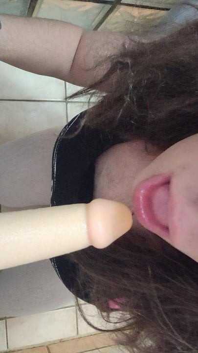 Crossdresser sucking dildo