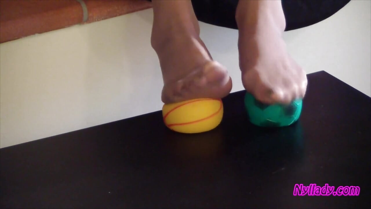 Nyllady Squeezes Rubber Balls Massaging Her Hosed Feet