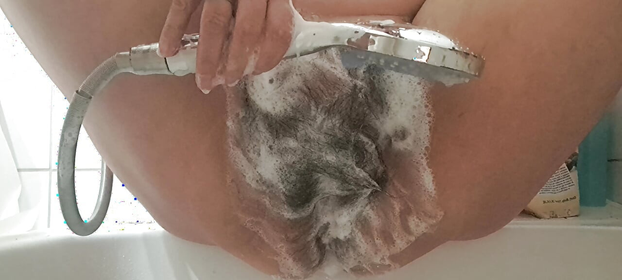 Masturbation with water dripping into the vagina of a mature MILF