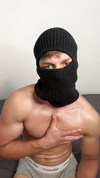 Masked horny hunk oiled up and teasing