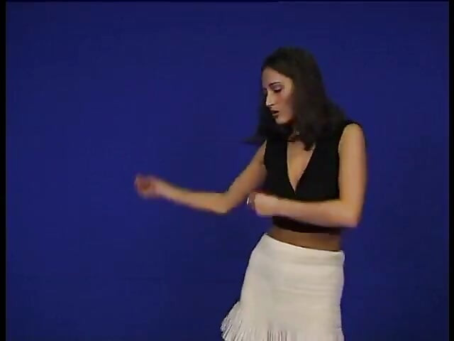 Brunette teen dancing and taking her clothes off