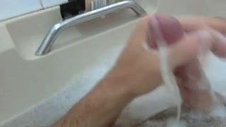 Mature guy jerking off in the bathtub