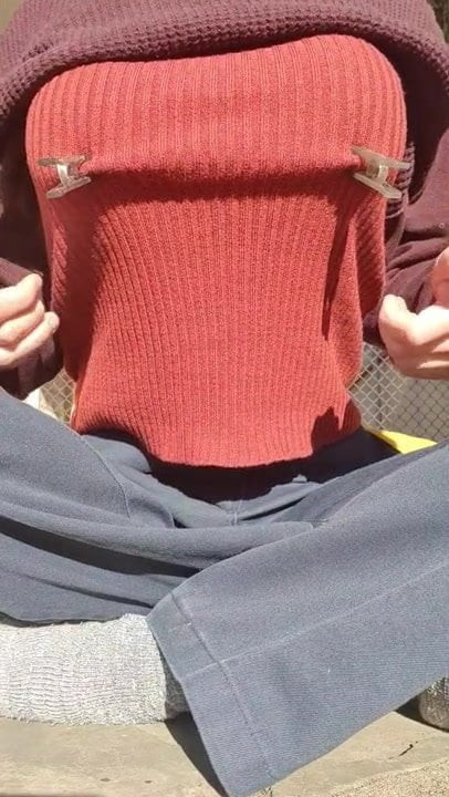 Clamping her nipples over clothes