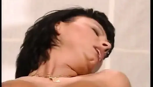 Sexy brunette in black stockings and nice tits rides a big cock