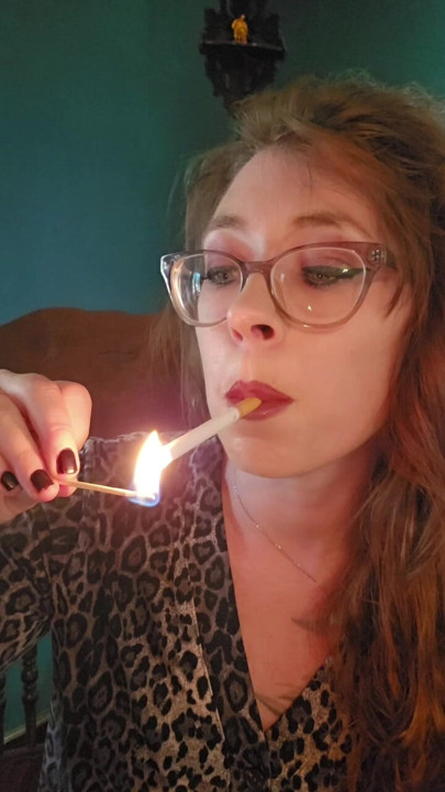 Cigarette Dangling while lighting a match