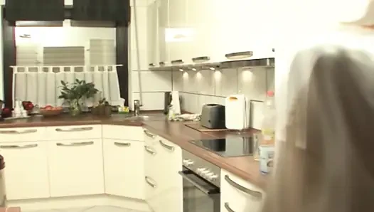 Attractive German maid in stockings rides dick in the kitchen