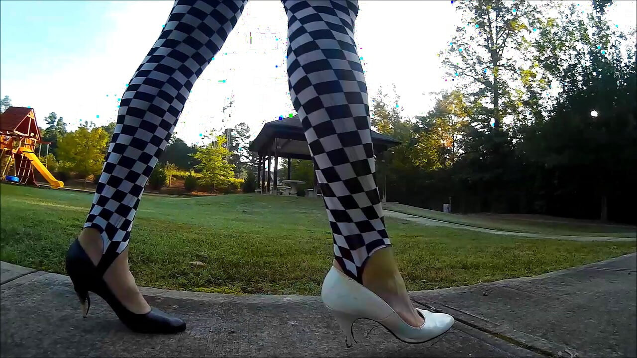 Crossdresser Walking in a public park in high heels