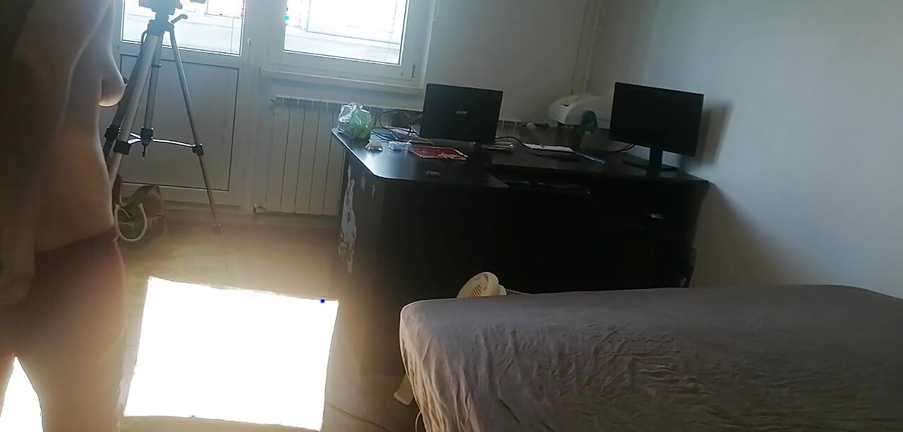 Amateur woman has fun trying on clothes and cutting them. Amateur woman vacuuming naked in the house.