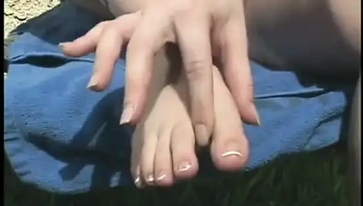 Fair-haired beauty Amber Peach fills her twat with fingers and massages her toes and feet