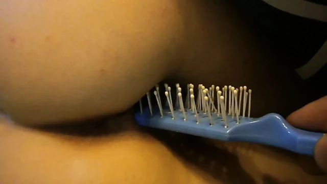 combing her pussy
