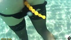 black stocking and anal beads in the sea