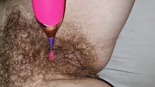 Wife's hairy wet cunt and pin point vibrator. Juice starts leaking from her cunt