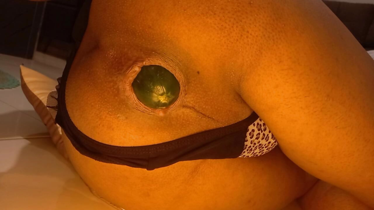 Naughty shemale opens her ass with a huge cucumber and I love it.