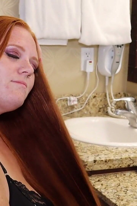 Brushing Her Long Red Hair