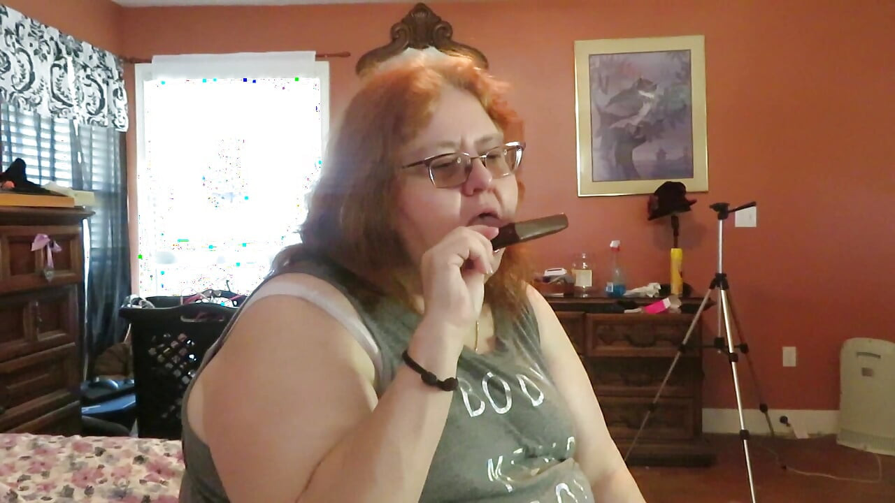 BBW nurse Vicki enjoys eatting a chocolate vanilla ice cream popsiscle