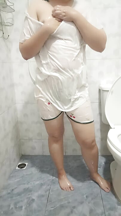Plump girl takes a shower