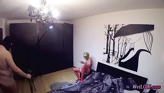 Behind the scene pissing in a glass
