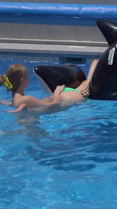 Lesbian Girls Are Having Fun in a Pool with an Inflatable Shark