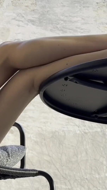 Braless hot beauty babe on the balcony shows her hairy pussy between her long legs at backstage | Clip 2