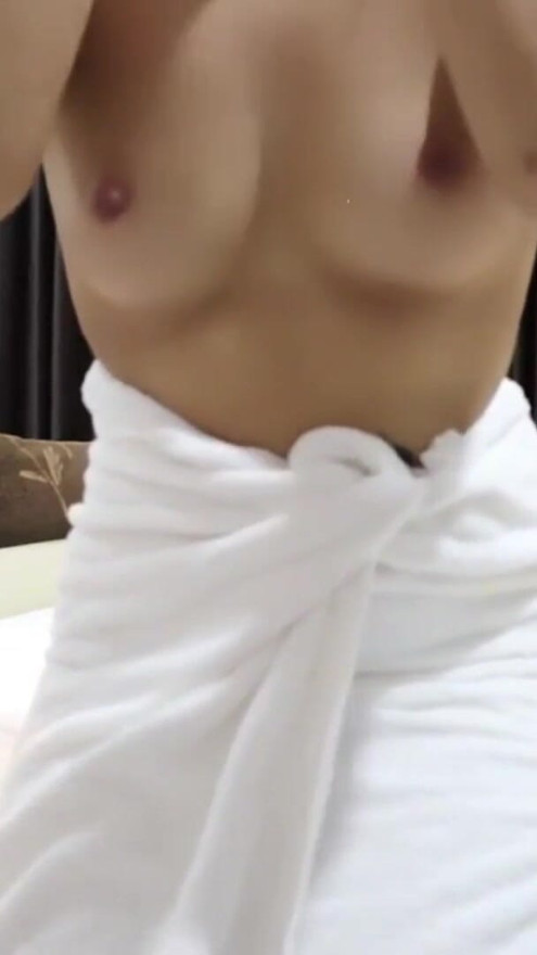 A Thai woman is taking a shower, revealing her pink nipples and smooth, soft vagina while applying body lotion.  Real Thai Solo | Clip 2