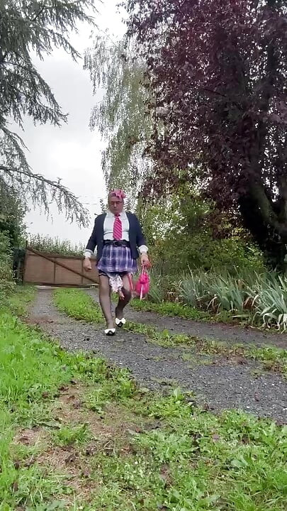 Dressed in a little pink plaid skirt for a party