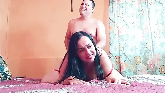 Curvy Latina in a red dress gets a good fucking in doggy style.