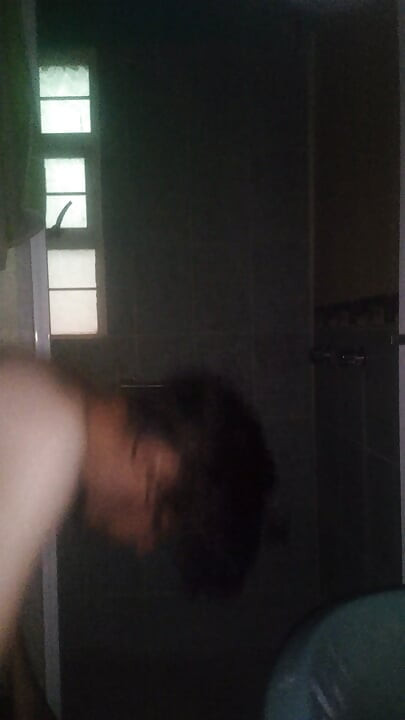 Man Showering with Flashlight On