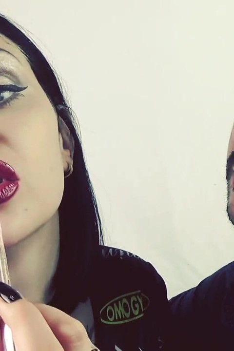 Covering Alex with red shiny lipstick kisses all over his face!