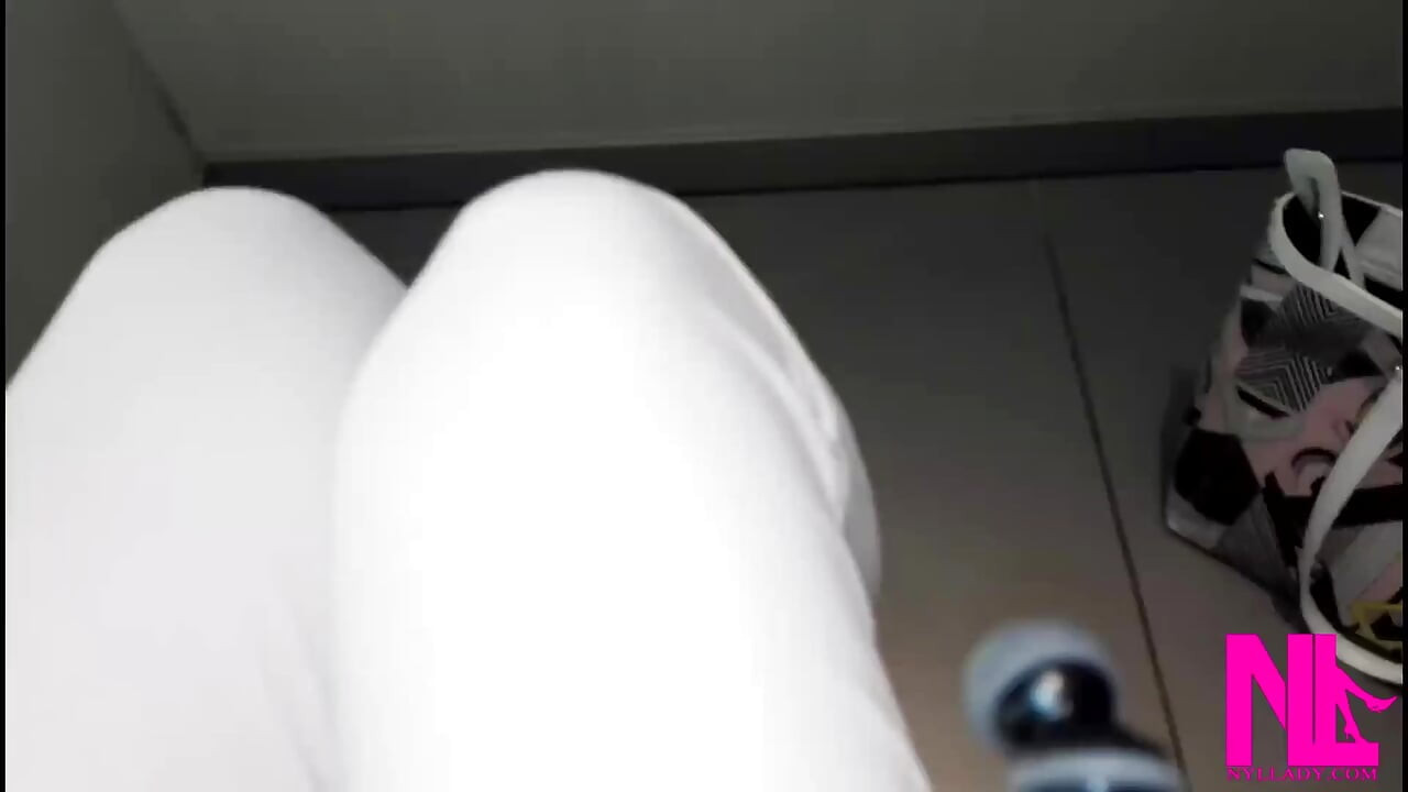 Dangling and Shoeplay in Black Pattent Pumps in a Store Closet
