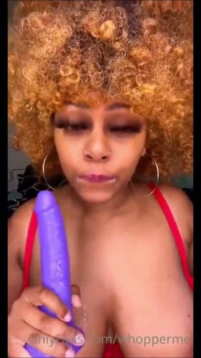 Cute ebony sucking dildo