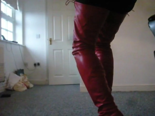 Standing in red crotch high ballet Boots
