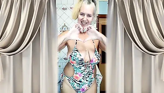 A Mature Woman Performs a Striptease in the Kitchen