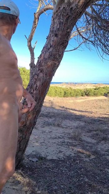 Walking and wanking my pierced shaved cock at the Beach