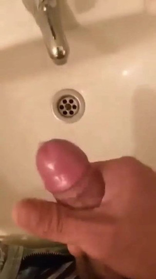 In the work bathroom he masturbates