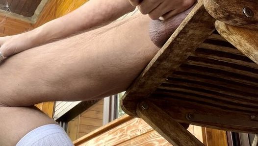 Sitting on my balcony somoke a cigarette and i feel so horny put my dick out and jerk of and at the and I shot a big load