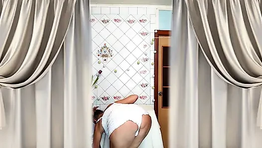Hot housewife Lukerya. A mature Ukrainian woman shows off her figure and poses for the camera at home.