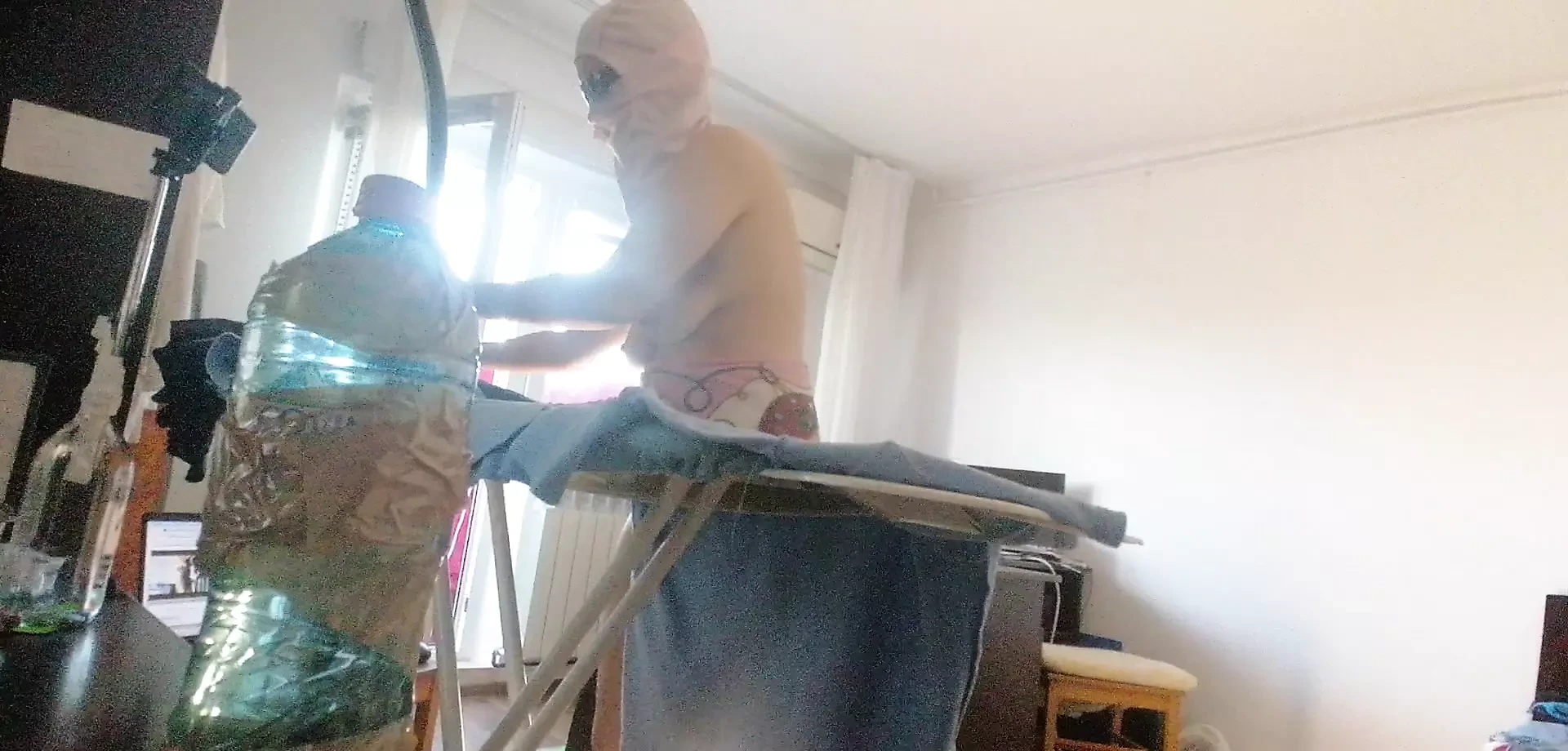 Amateur wife doing housework naked. Sexy and naughty wife trying on clothes that she cuts.