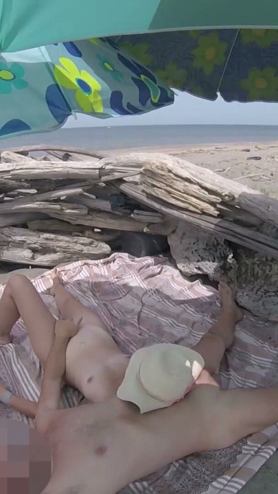 On a nudist beach in Tenerife, the stepdaughter jerks off her stepfather's cock without shame | Clip 2