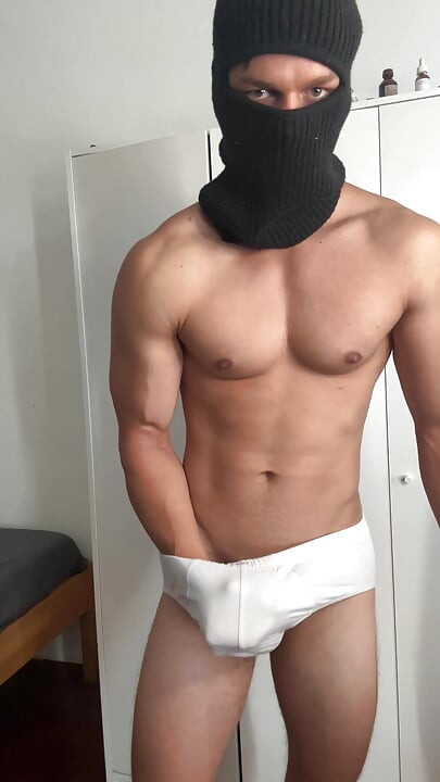 Young bodybuilder teasing in balaclava